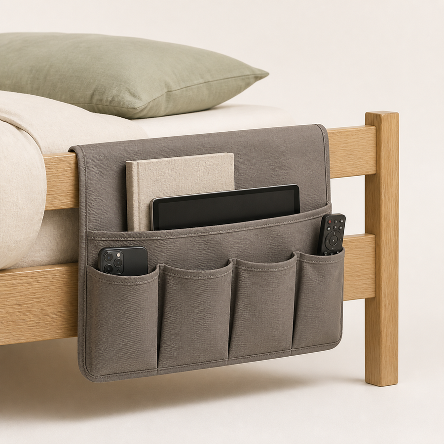 Gray canvas bedside caddy hanging from a bed frame