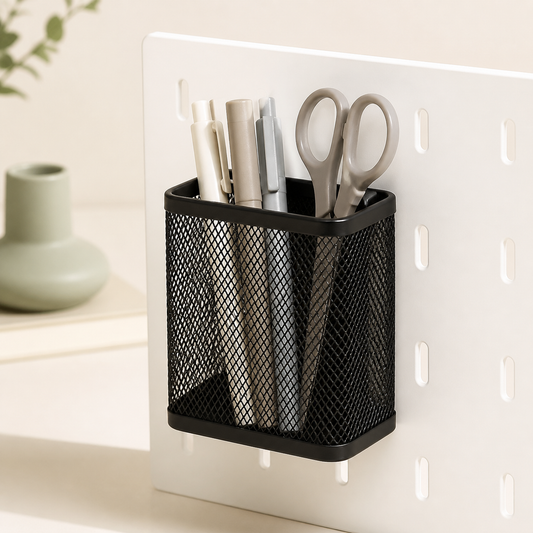 Black Cumya magnetic mesh organizer holding pens and scissors on a white metal board