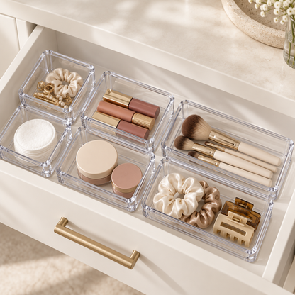 Six Yoaxo clear organizer bins arranged inside a vanity drawer